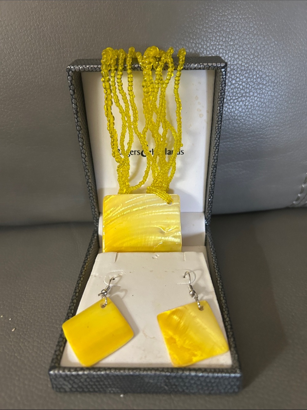 Yellow Multi-Strand Beaded Necklace with Square Pendant and Matching Earrings.